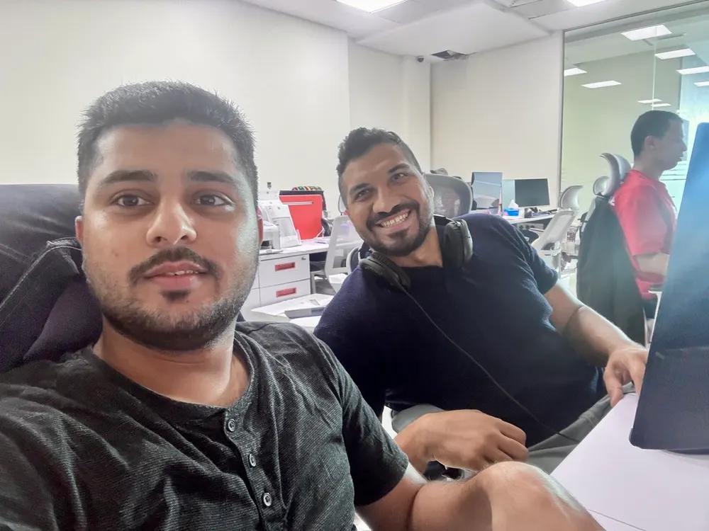Working with a colleague at the office in Dubai